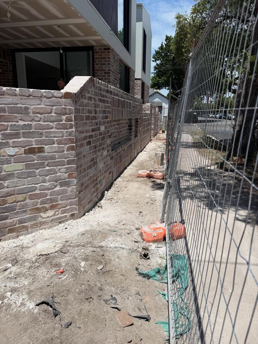 Brick wall finished to the boundary line
