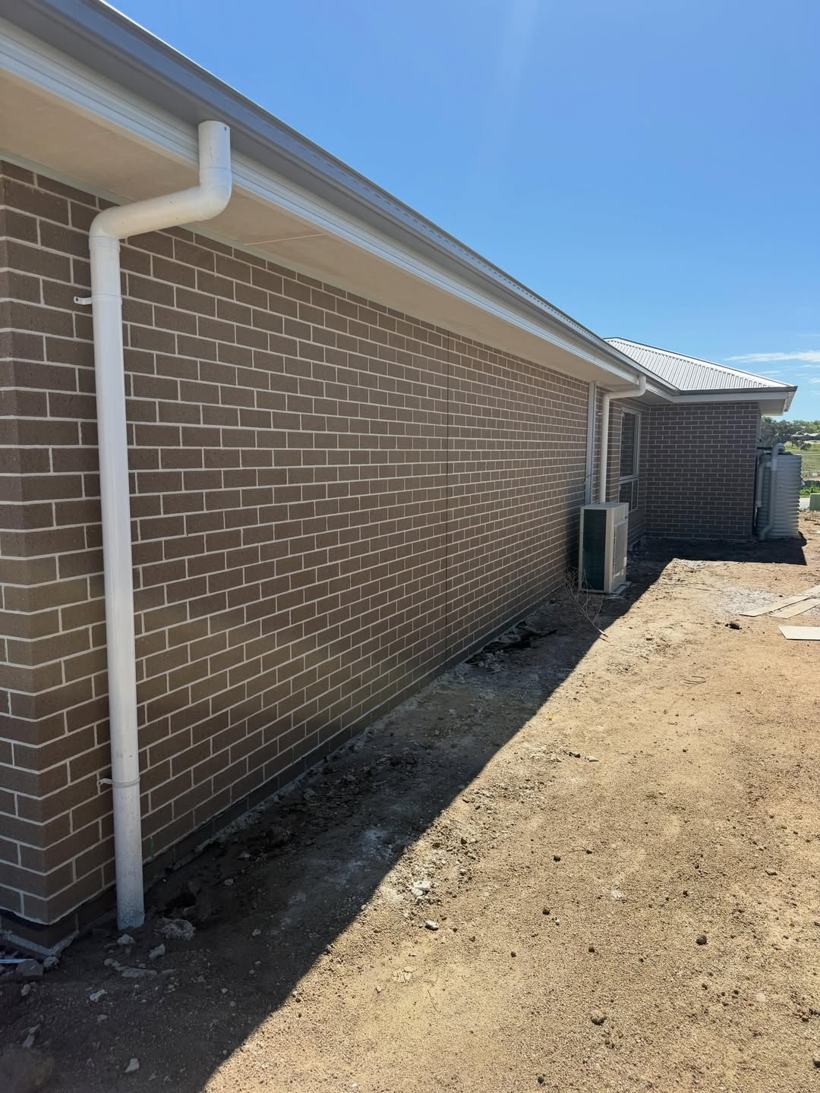 Clean brick veneer side elevation of a new home