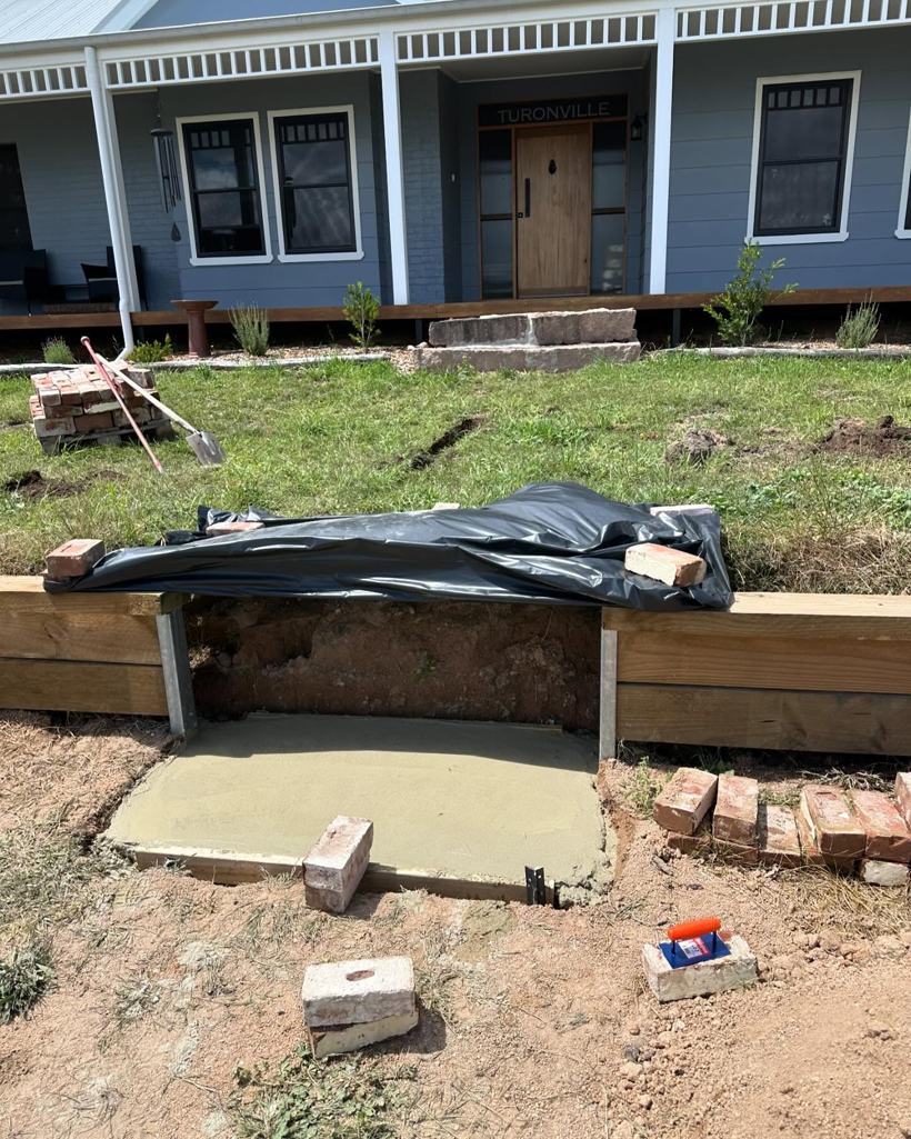 Front yard with the old steps removed, ready for new brick steps